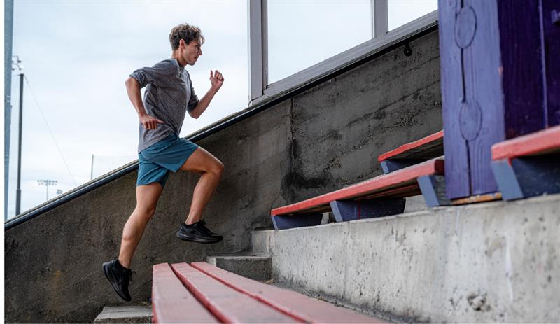 Person running up a set of outdoor stairs