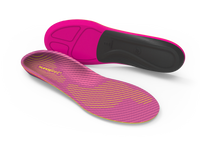 Pink and black shoe insoles on a white background