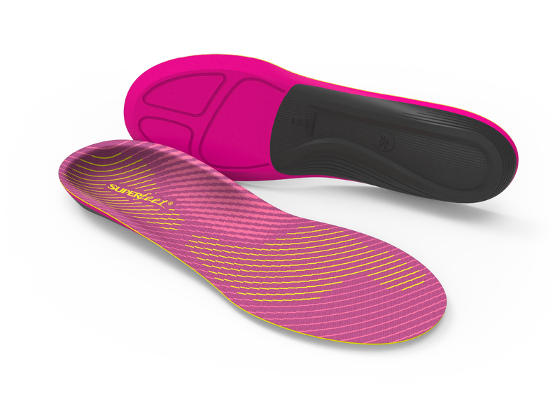 Pink and black shoe insoles on a white background