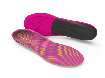 Pink and black shoe insoles on a white background